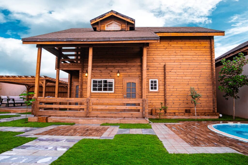 pexels-photo-14459280 A picturesque wooden bungalow with a large porch, perfect for outdoor relaxation.